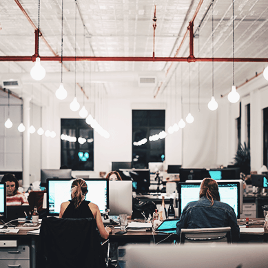 People working in an open plan office