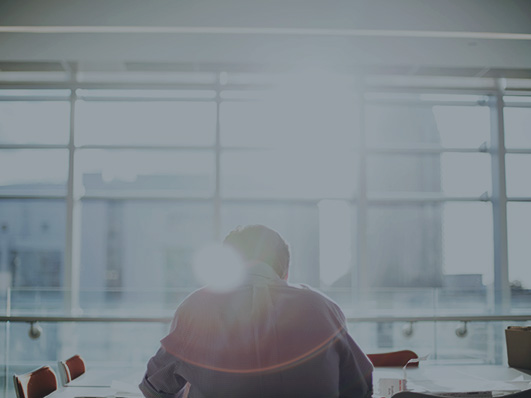 Person alone in a meeting room